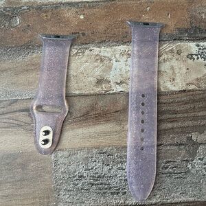 Purple/pink sparkles clear in color. Fits with the sized 44 mm Apple Watch.